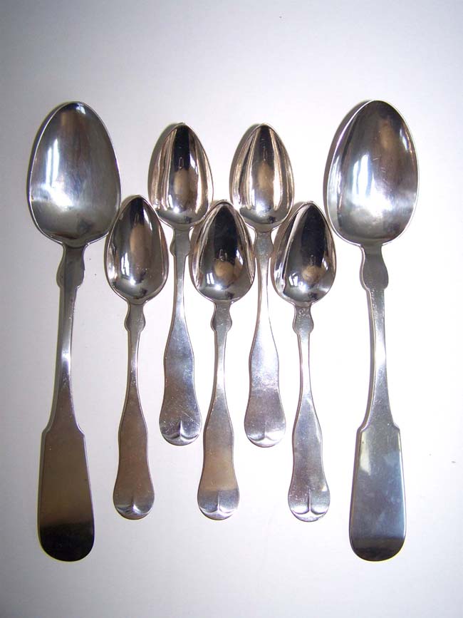 A Grouping of 5 antique coin silver teaspoons and 2 tablespoons made by Cape Cod silversmith John Munroe of Barnstable circa 1840.